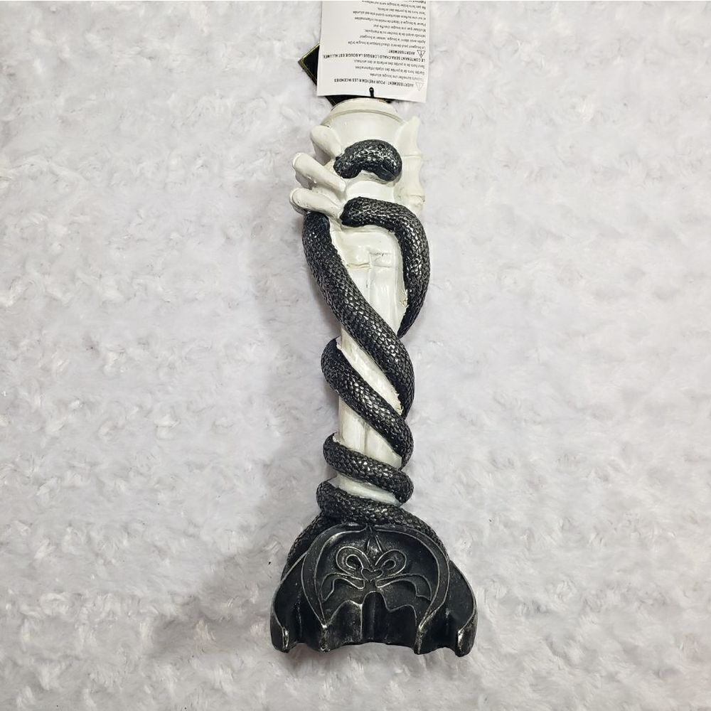 Skeleton hand and snake candle holder